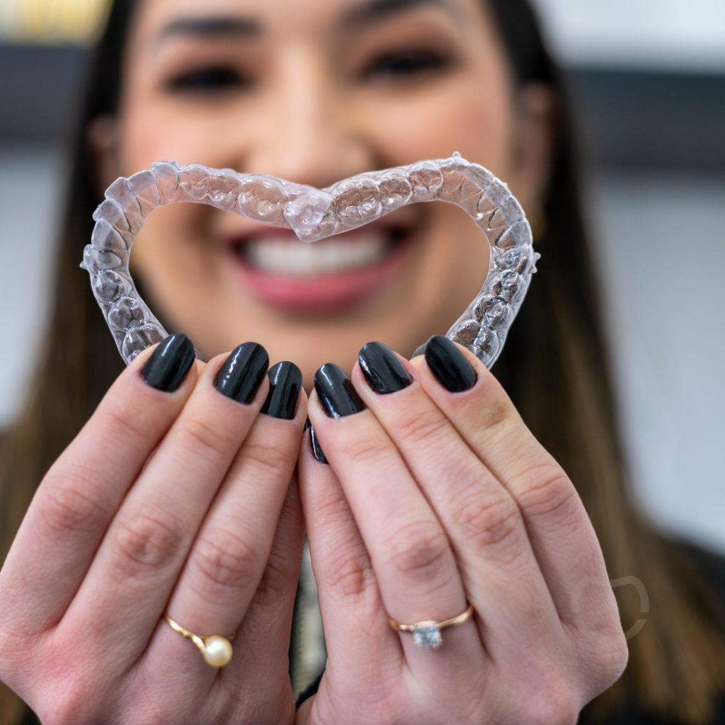 Patient wearing clear aligners in Johnstone, showing a discreet orthodontic treatment option.