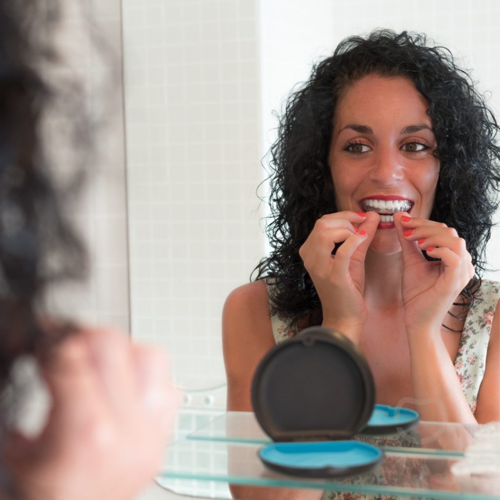 Patient wearing clear aligners in Johnstone, showing a discreet orthodontic treatment option.